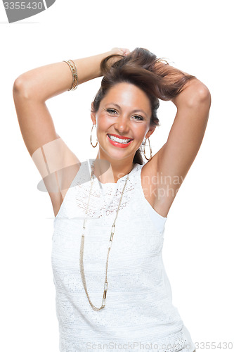 Image of Happy Woman in Trendy Outfit Holding her Hair Up