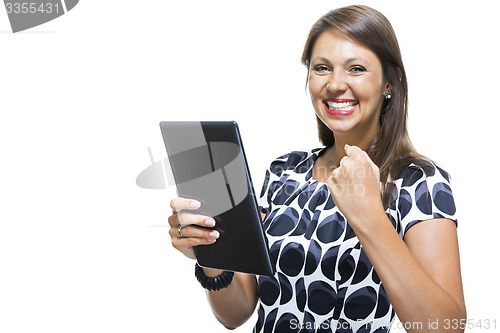 Image of Smiling Woman in a Dress Holding a Tablet Computer