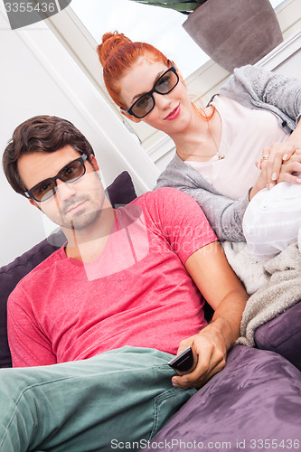 Image of Couple Wearing 3D Glasses with Shocked Faces