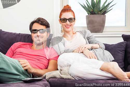 Image of Couple Wearing 3D Glasses with Shocked Faces