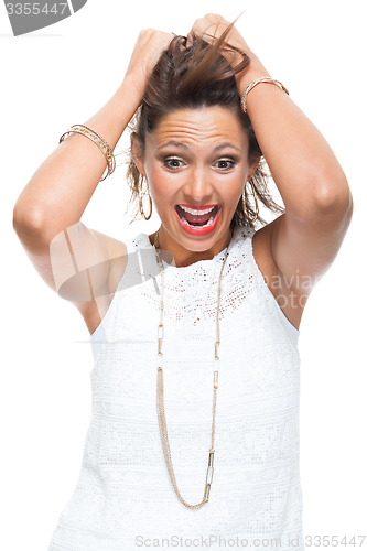 Image of Happy Woman in Trendy Outfit Holding her Hair Up