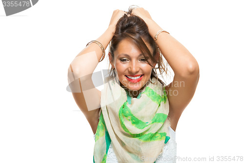 Image of Laughing Pretty Woman Holding Back her Hair