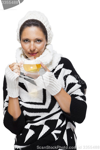 Image of Elegant woman in a black and white winter outfit