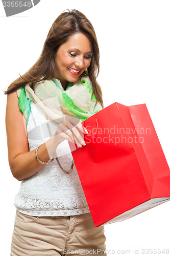 Image of Fashionable Woman Looking Inside a Shopping Bag