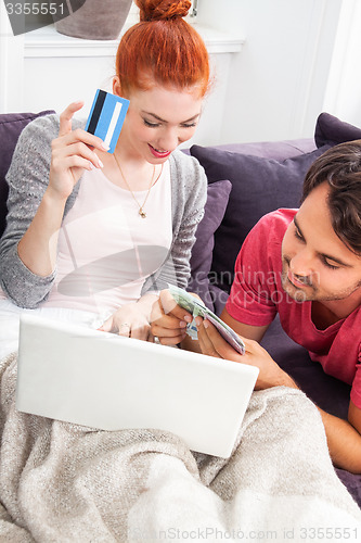 Image of Young Couple Watching a Movie on Laptop Together