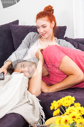 Image of Young Couple Relaxing on Couch In the Living Room