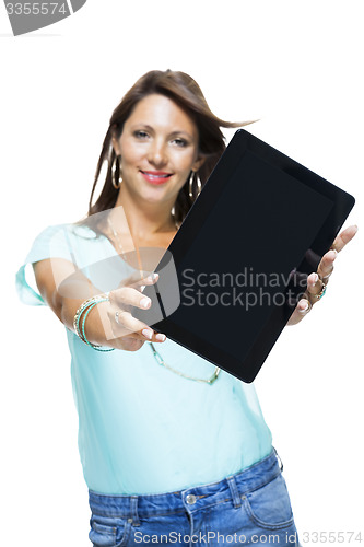 Image of Pretty Woman Browsing at her Tablet Computer