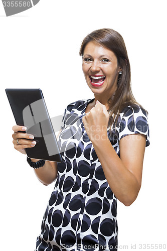 Image of Smiling Woman in a Dress Holding a Tablet Computer