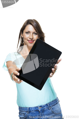 Image of Pretty Woman Browsing at her Tablet Computer