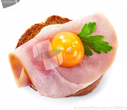 Image of toasted bread with ham and tomato