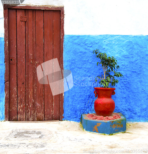 Image of historical blue  in  antique building door morocco      style af