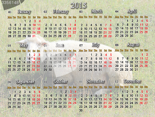 Image of calendar for 2015 with sheep on the background