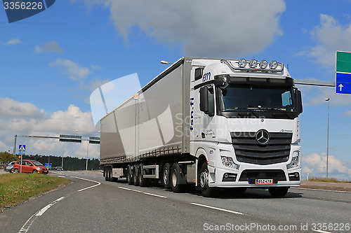 Image of White Mercedes-Benz Actros Truck Trailer in Traffic