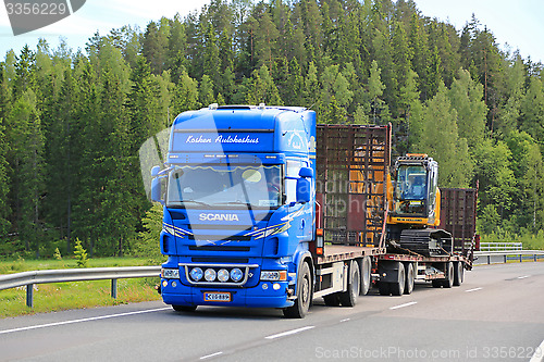 Image of Scania V8 Truck Hauls New Holland Crawler Excavator