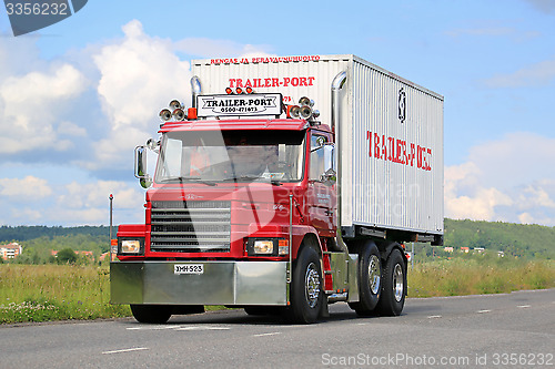 Image of Red Conventional Scania T92 on the Road