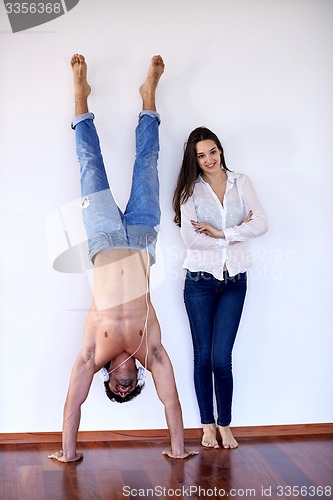 Image of happy young romantic couple have fun and  relax at home indoors