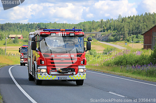 Image of Two Scania Fire Trucks on the Road at Summer