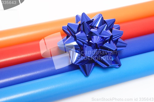 Image of Colorful wrapping paper and a gift bow