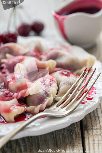 Image of Plate with cherry dumplings.