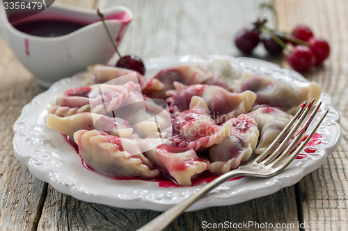 Image of Sweet dumplings with cherry.