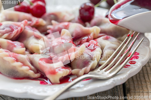 Image of Homemade dumplings with cherries.