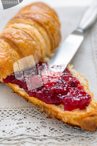 Image of Croissant with jam for breakfast.