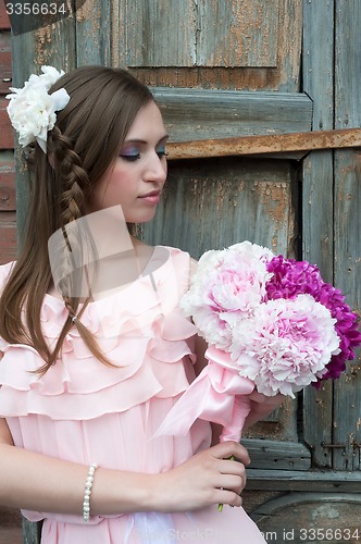 Image of Beautiful sad woman with flower...