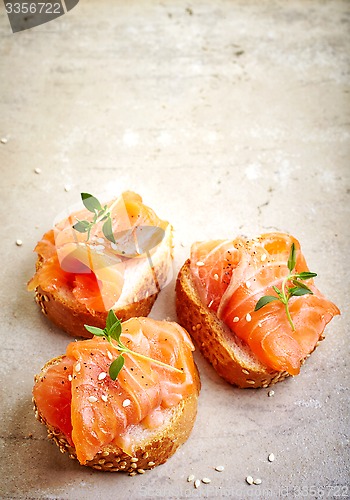Image of bread with fresh salmon fillet