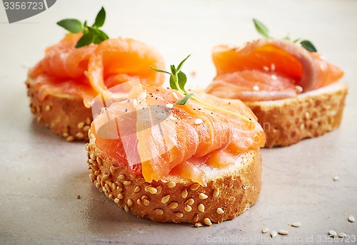 Image of bread with fresh salmon fillet