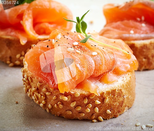 Image of bread with fresh salmon fillet