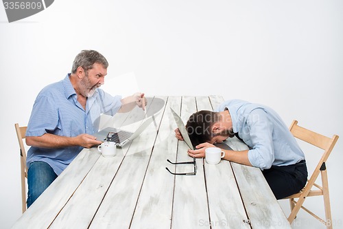 Image of The two colleagues working together at office on white background