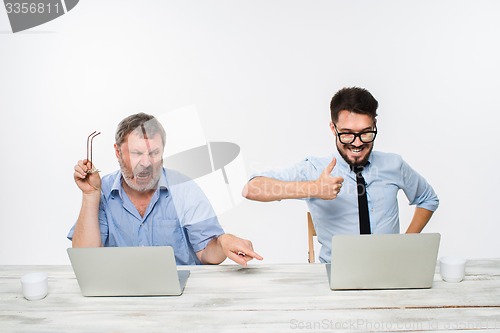 Image of The two colleagues working together at office on white background