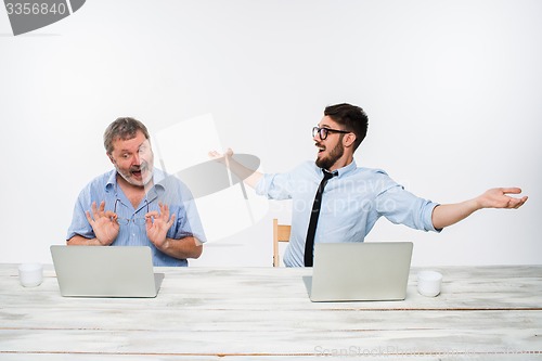 Image of The two colleagues working together at office on white background