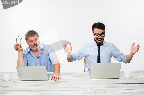 Image of The two colleagues working together at office on white background