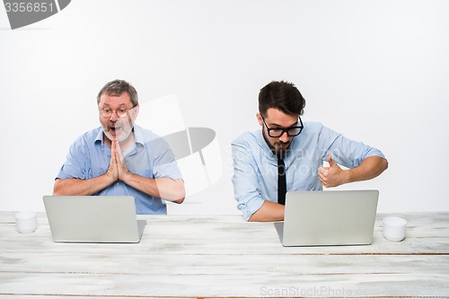 Image of The two colleagues working together at office on white background