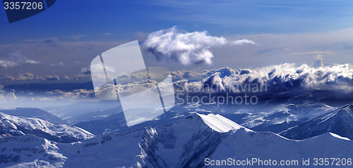 Image of Panoramic view of mountains at evening and sunlight clouds