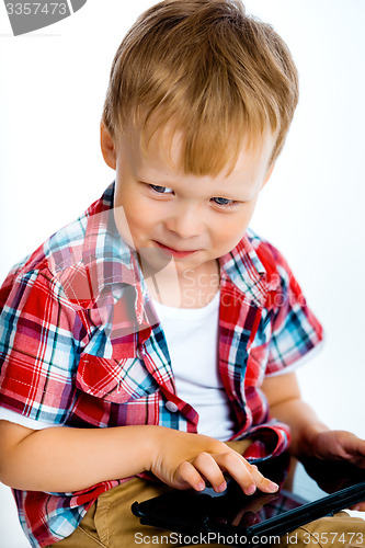 Image of smiling boy with a tablet computer