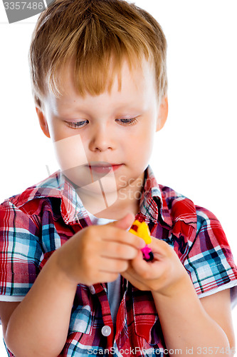 Image of Little boy with a toy