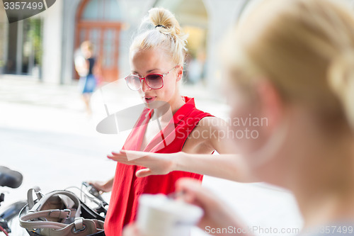 Image of Female friends enjoying a conversation.