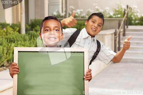 Image of Boys with Thumbs Up Holding Blank Chalk Board on Campus