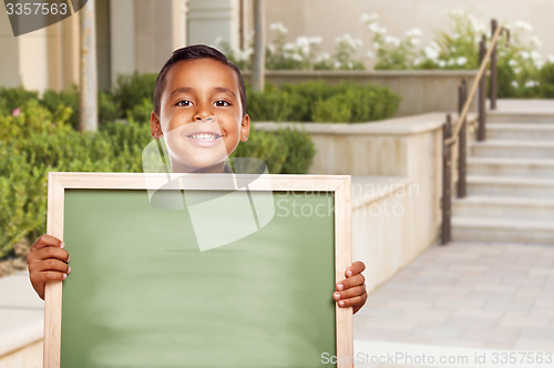 Image of Hispanic Boy Holding Blank Chalk Board on School Campus