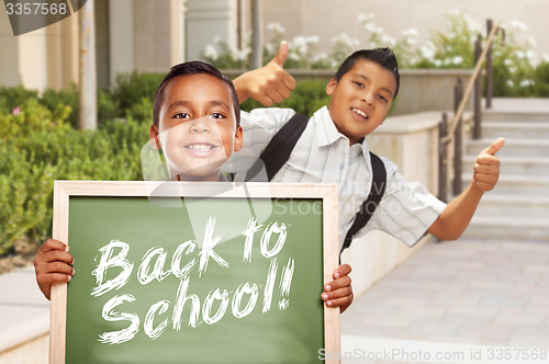 Image of Boys Giving Thumbs Up Holding Back to School Chalk Board