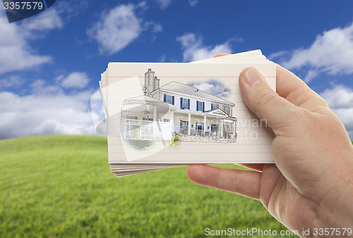 Image of Male Hand Holding Stack of Flash Cards