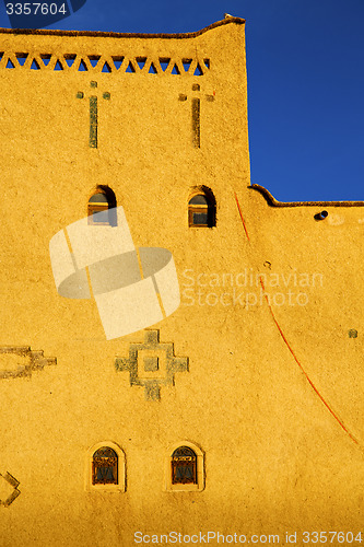 Image of old brown construction in africa morocco and   near the tower