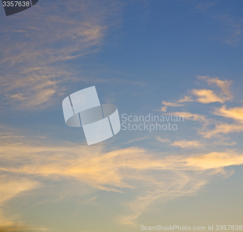 Image of the sunrise in  colored sky white soft clouds and abstract backg