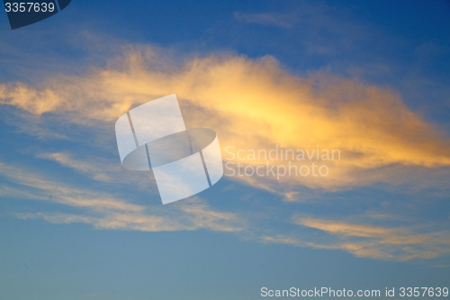 Image of the sunrise in  colored sky white soft clouds and  background