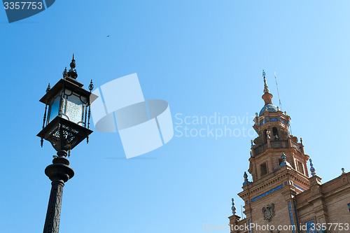 Image of Lampost and tower at Spain square