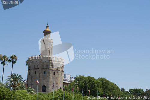 Image of Gold tower with flags