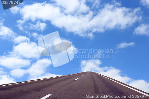 Image of picturesque white clouds on blue sky background