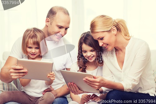 Image of family and two kids with tablet pc computers